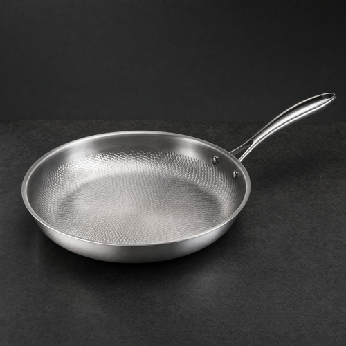 The Titanium Pan seen at a three quarter angle on charcoal stone