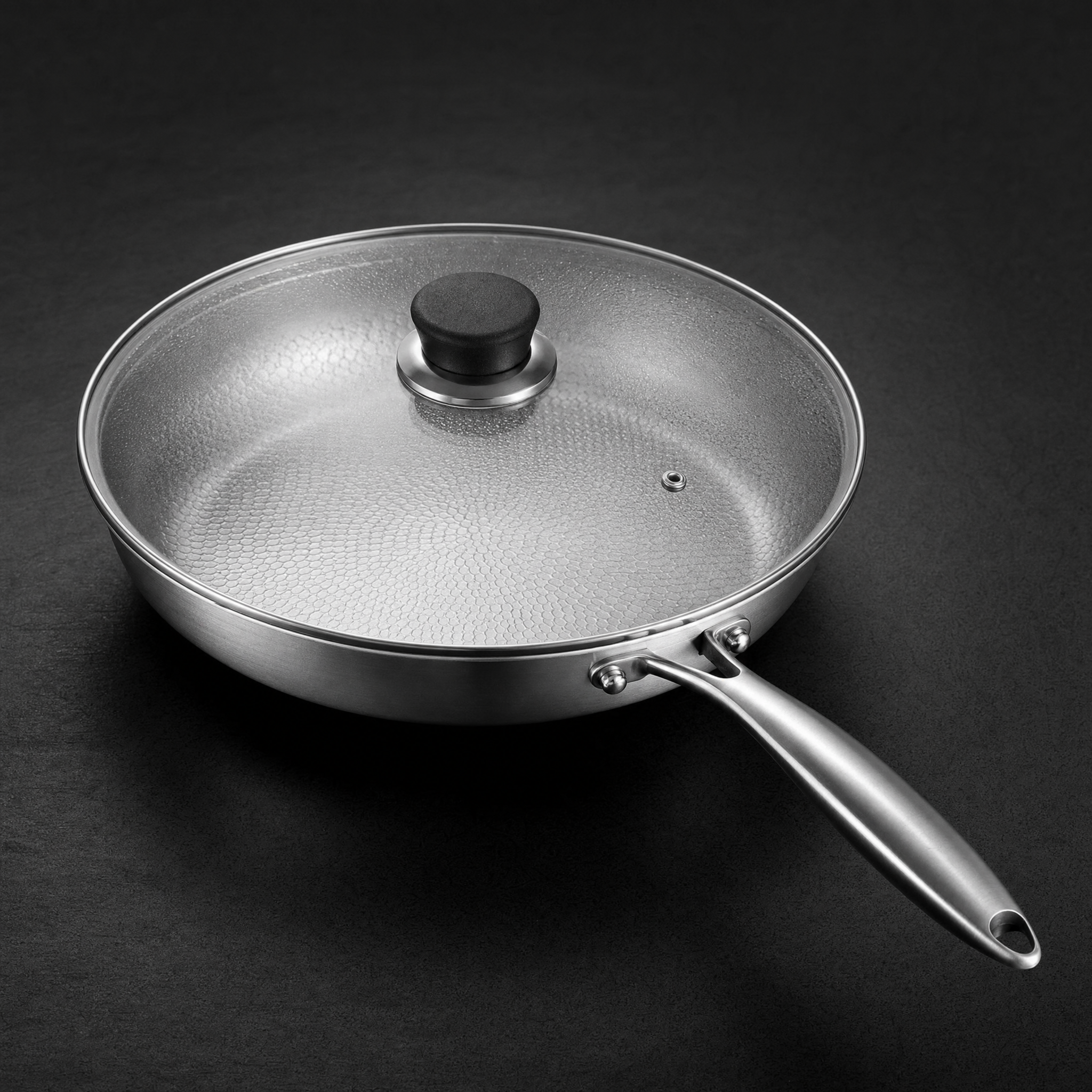 The tempered glass lid on the pan