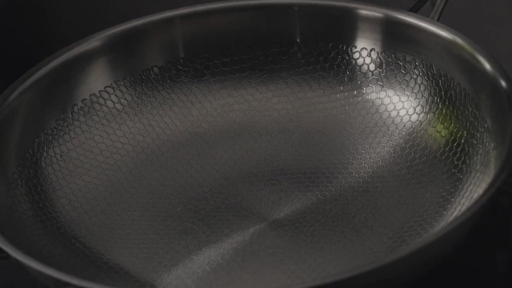 The Titanium Pan turning slowly under raking light