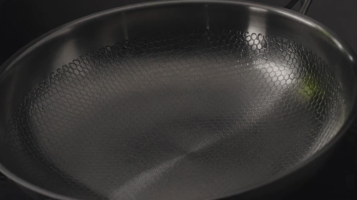 The Titanium Pan turning slowly under raking light