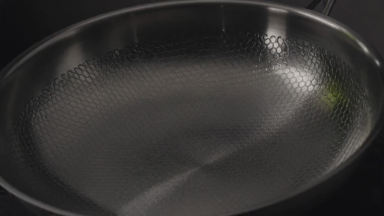 The Titanium Pan turning slowly under raking light