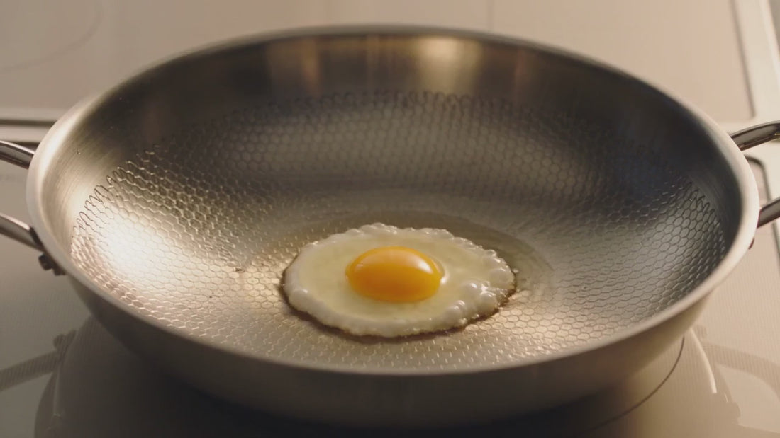 An egg releasing cleanly from a preheated, lightly oiled pan